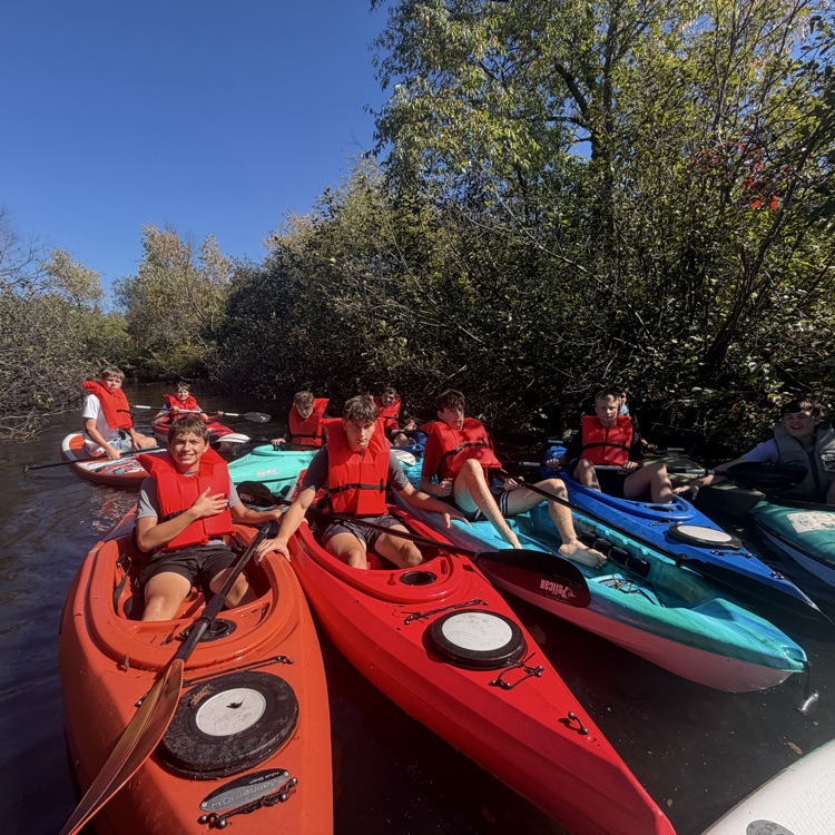 students paddling