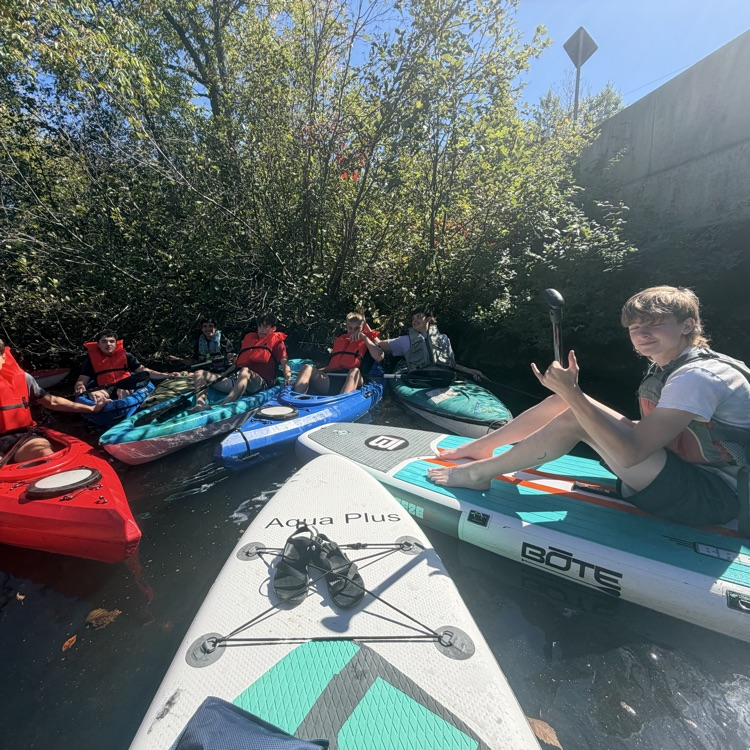 students paddling