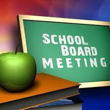 a green chalkboard that says School Board Meeting, with a green apple in front of it sitting on top a stack of books