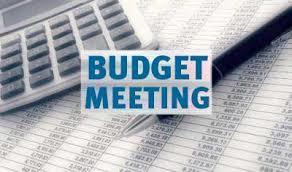 a graphic of a calulator and a budget with the words Budget Meeting