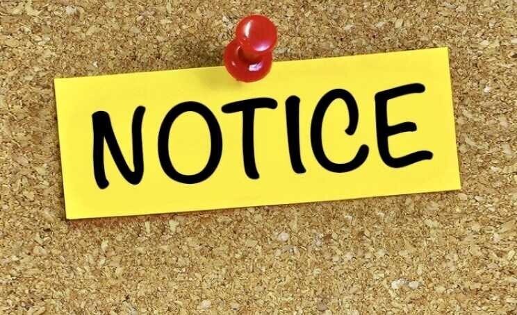 a cork board with a yellow note pinned to it that says Notice