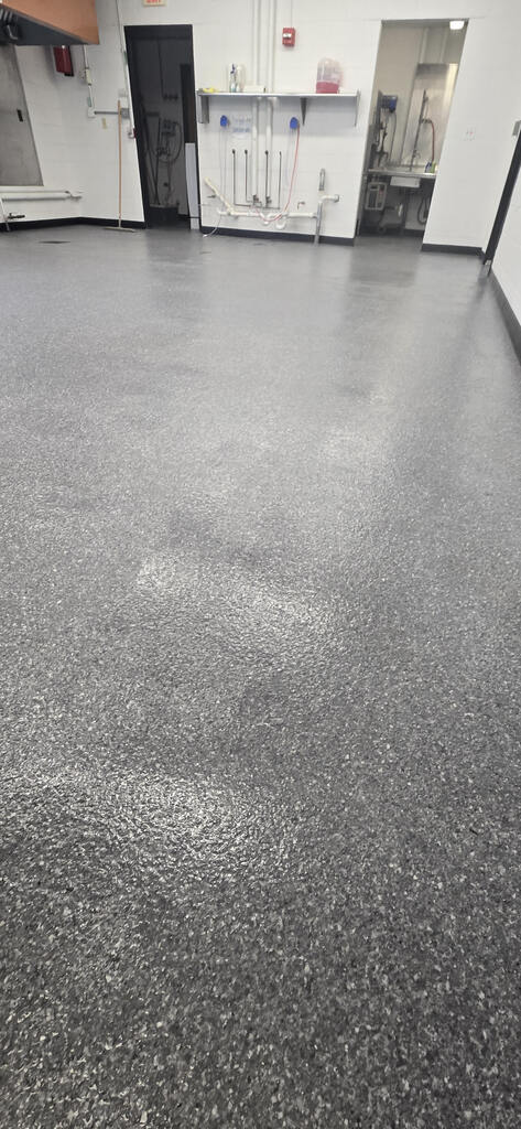 A graphic of the grey epoxy floor that we put in the school kitchen