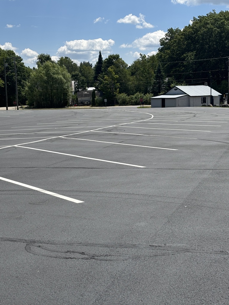 a graphic of our newly seal coated parking lot with newly painted white strips for the parking spaces