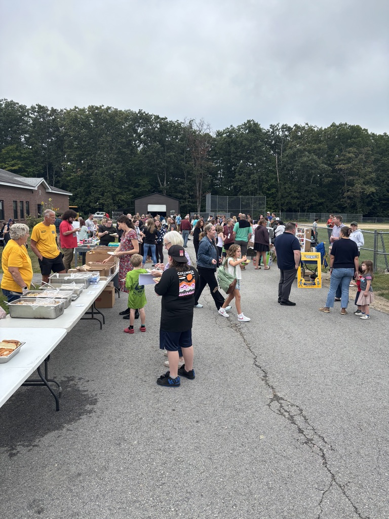 A picture of families at the Wakefield BBQ, standing outside talking