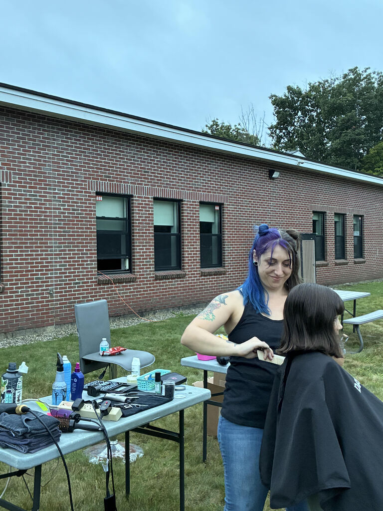a picture of a haircut getting done