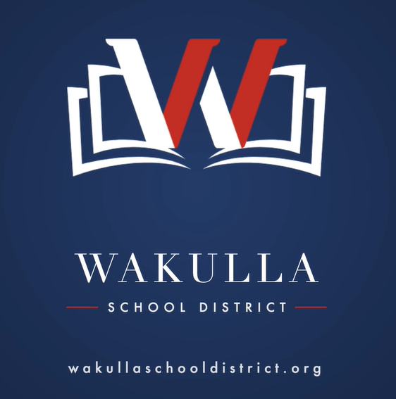 Wakulla County School Logo in Red and White with a blue background
