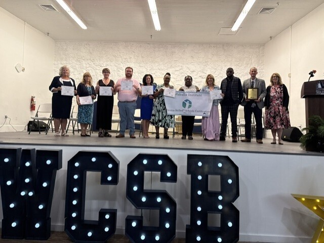 WI Teacher receiving their certificates from TraumaSkilled Schools