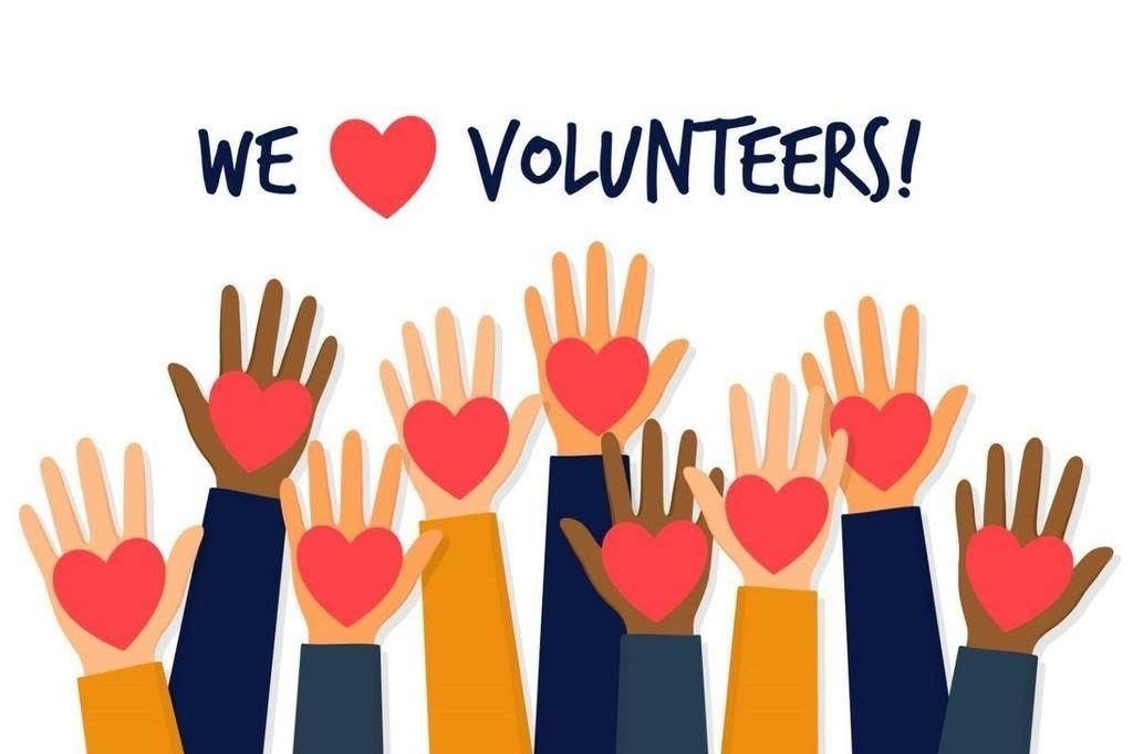 Hands with hearts on them reaching up like volunteering