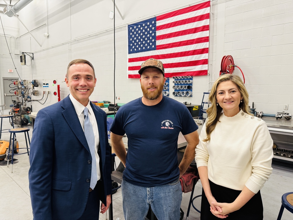 Chancellor O'Farrell, Diesel Instructor Johnny Slusher, and Chancellor Dr. Yopp Meros posing.