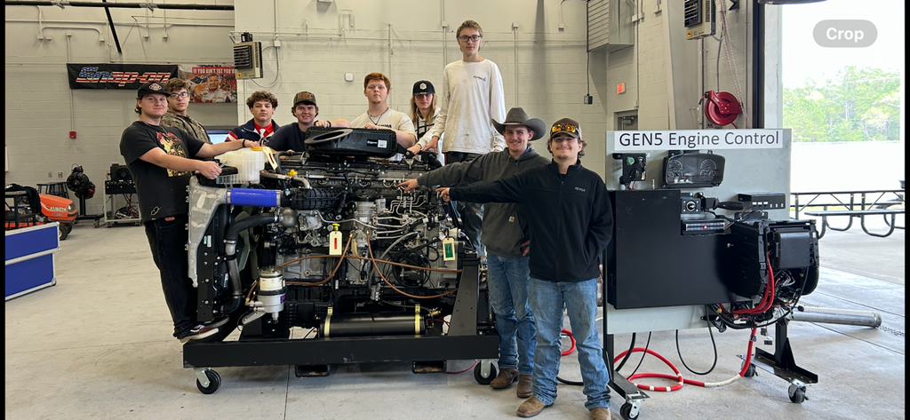 DD15 Diesel engine and smiling students