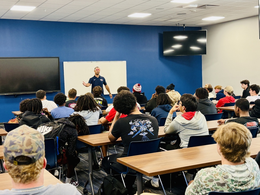  New Head Coach Allen meets with football players