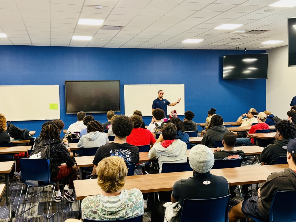 New Head Coach Allen meets with football players