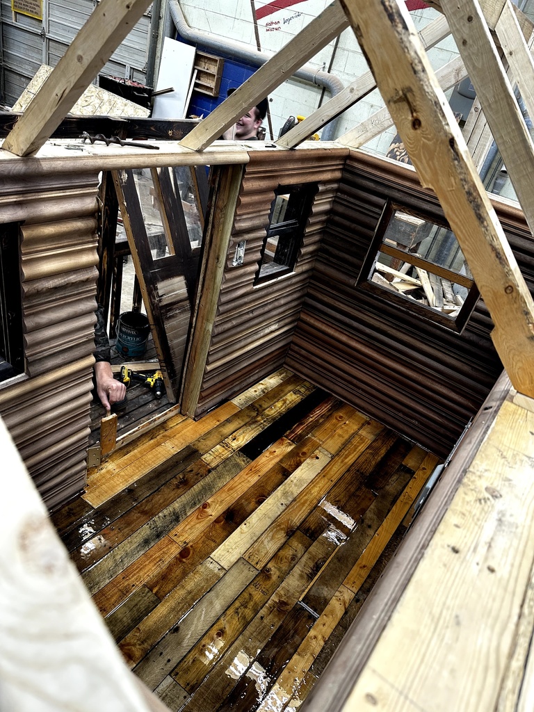 Carpentry students building a playhouse from the ground up.