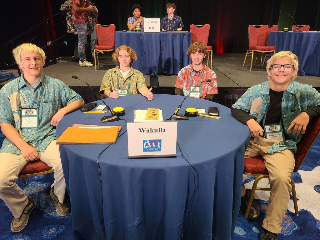 Academic team at their table for competition