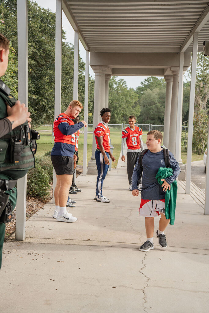 Wakulla High School football seniors welcomed students at Medart Elementary 