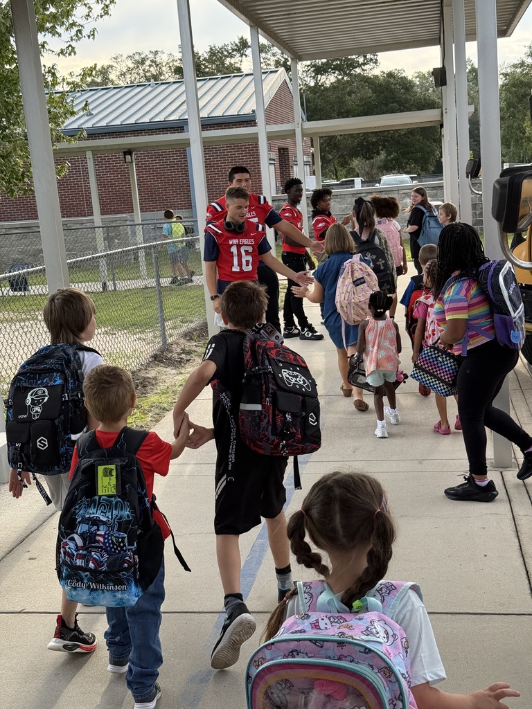 Wakulla High School football seniors welcomed students at Medart Elementary 
