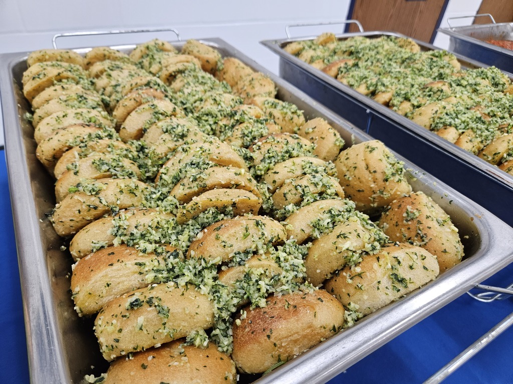 Trays of garlic rolls topped with herbs and seasoning, prepared by Wakulla County Schools Food Services.