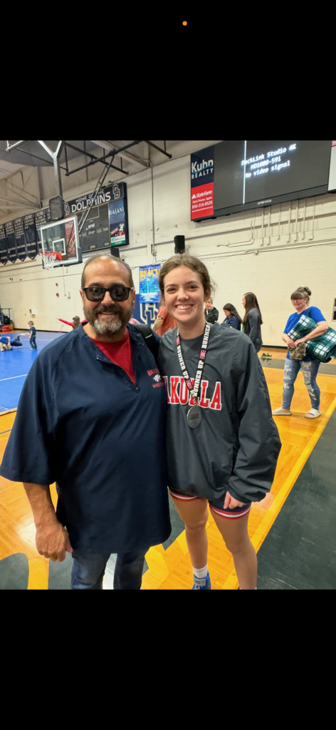 It is with heavy hearts that we remember and honor Benjamin “Benny” Litowski, who faithfully served as a School Guardian at Wakulla High School since 2022. Benny smiling with Julia Baggett, wrestler.