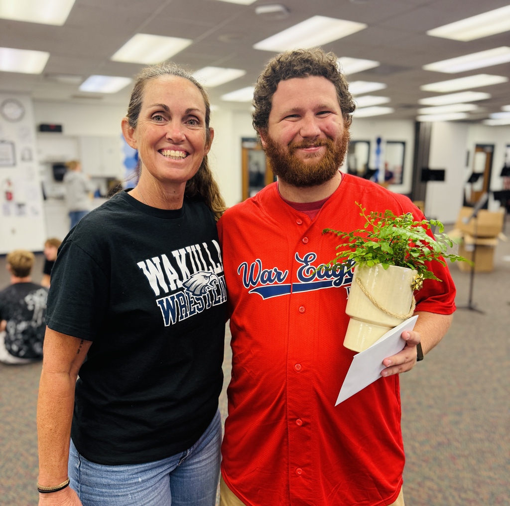 Principal Michele Falk and September Teacher of the Month Matthew Spindler