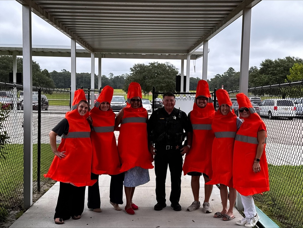 Staff picture dressed as traffic cones