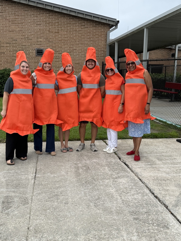 Staff picture dressed as traffic cones
