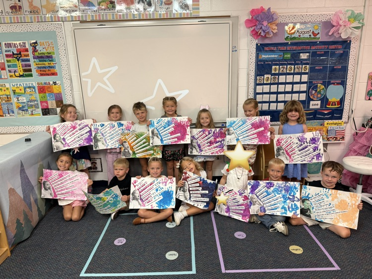 PreK students experiment with hands on materials to create an “All About Me” project about themselves 