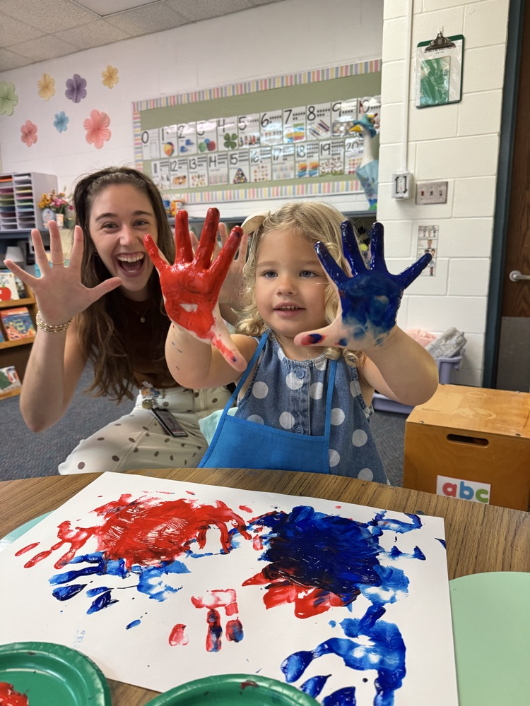 PreK students experiment with hands on materials to create an “All About Me” project about themselves 