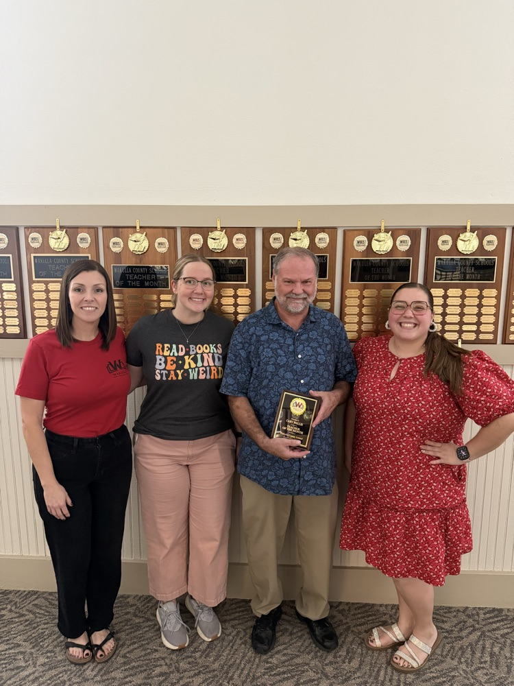 Mr. Wallis and team members