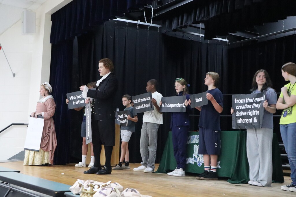 Students participate on stage as Founding Voices visits RMS