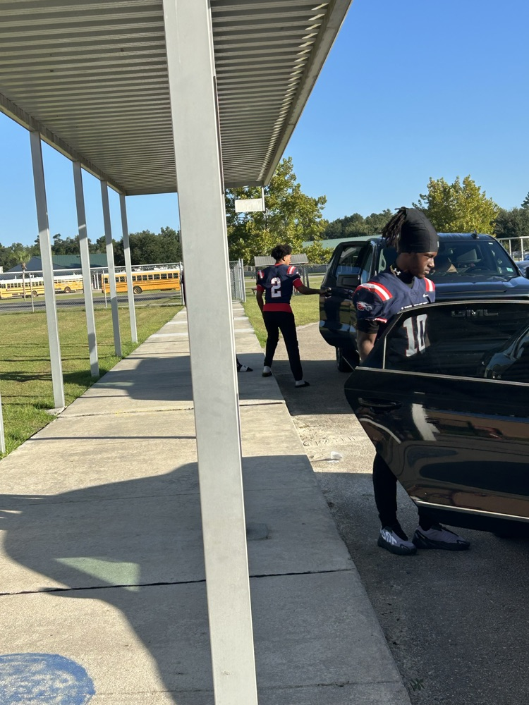 WHS Football Players helping with morning drop off 
