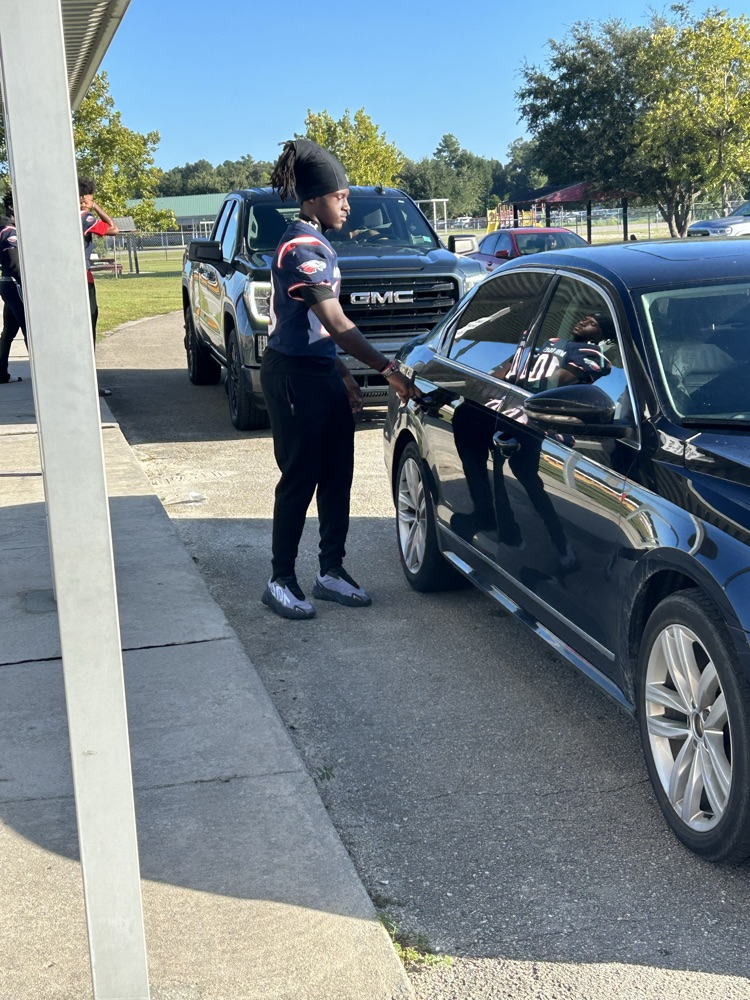 WHS Football Players helping with morning drop off 