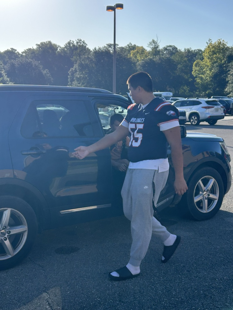 WHS Football Players helping with morning drop off 