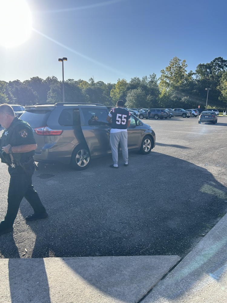 WHS Football Players helping with morning drop off 