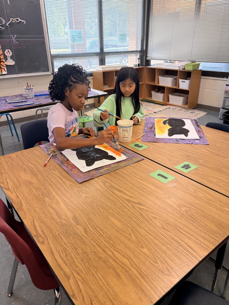 Students working on cat art project