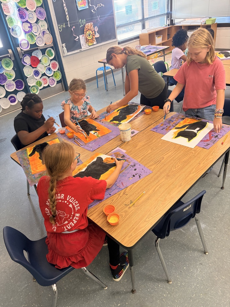 Students working on cat art project