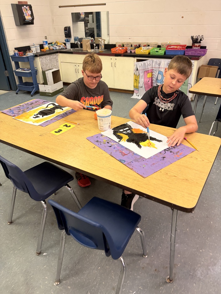 Students working on cat art project