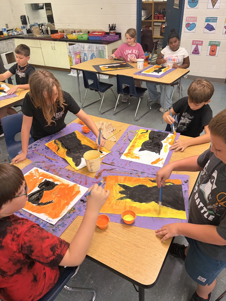 Students working on cat art project