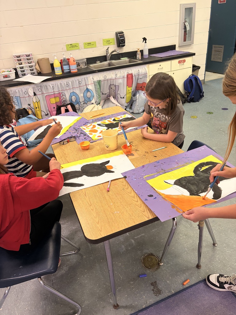 Students working on cat art project