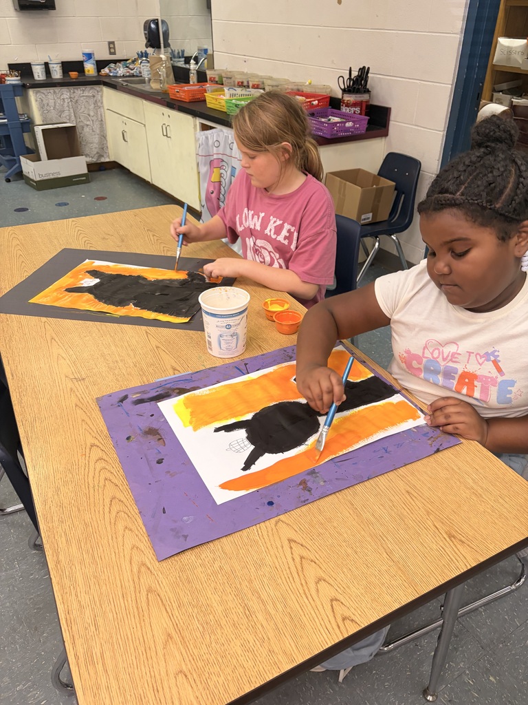 Students working on cat art project