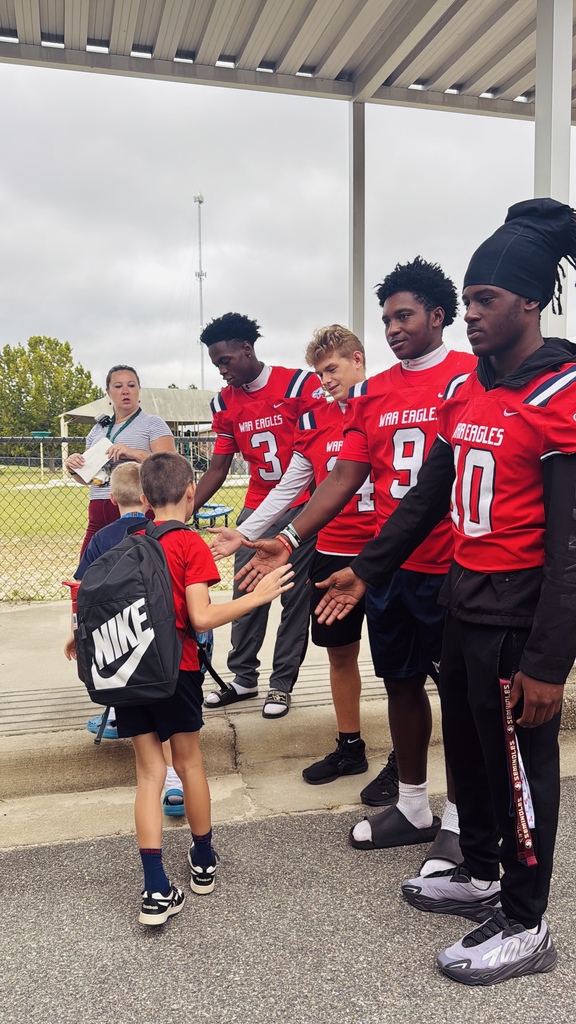 War Eagle Football Players giving hi-fives