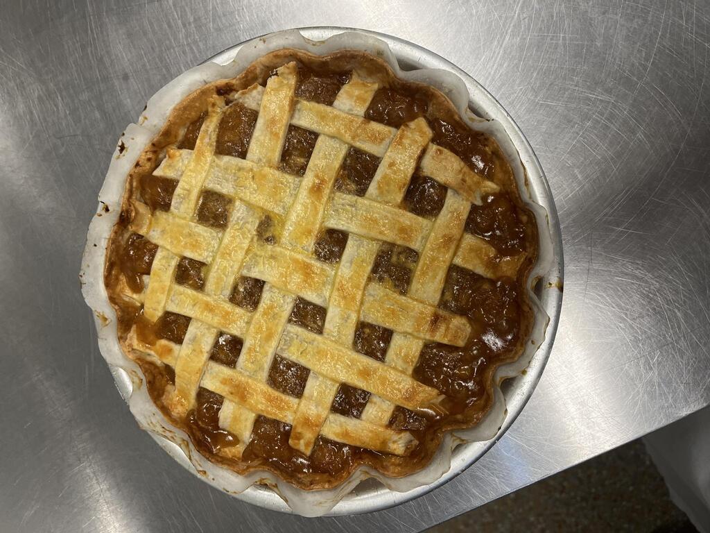 Halfway to Pi Day called for pie! 🥧  On September 14, our Cooking Methods students celebrated by making peach pies from scratch. Cooking Methods is part of WHS’s Hospitality and Tourism CTE program, where students build their skills through hands-on experiences like this one.  And yes, the results look delicious!