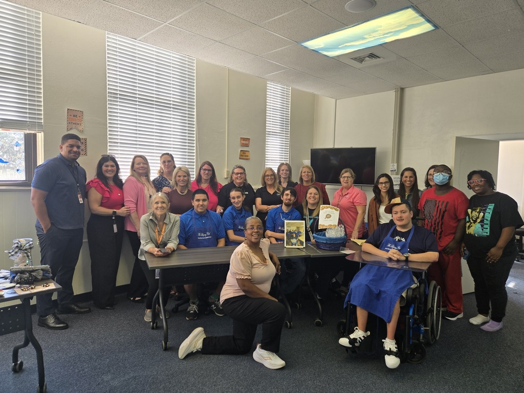 Mrs. Hernandez, Mrs. Strickland and Mrs. Kelly with students from the Legacy Boutique program at the Bloxham Building