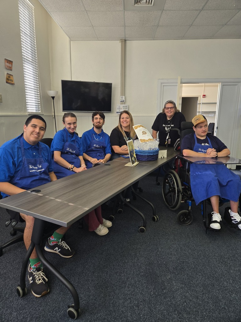 Mrs. Spears and Ms. "Sharon" with students from the Legacy Cafe' (Post Grad Program) at the Bloxham Building