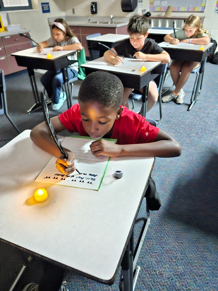 Students used ink and a quill to write the preamble to the constitution as if they were actually there in 1787