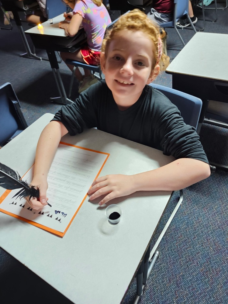 Students used ink and a quill to write the preamble to the constitution as if they were actually there in 1787