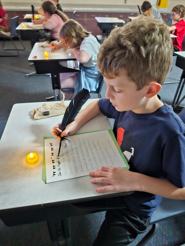 Students used ink and a quill to write the preamble to the constitution as if they were actually there in 1787