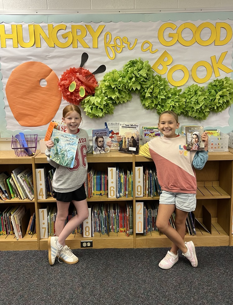 girls holding books