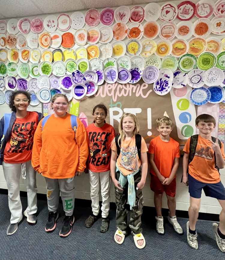 students wearing orange