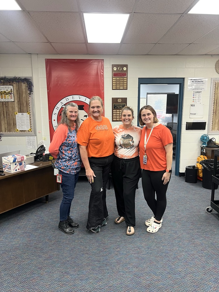 staff wearing orange