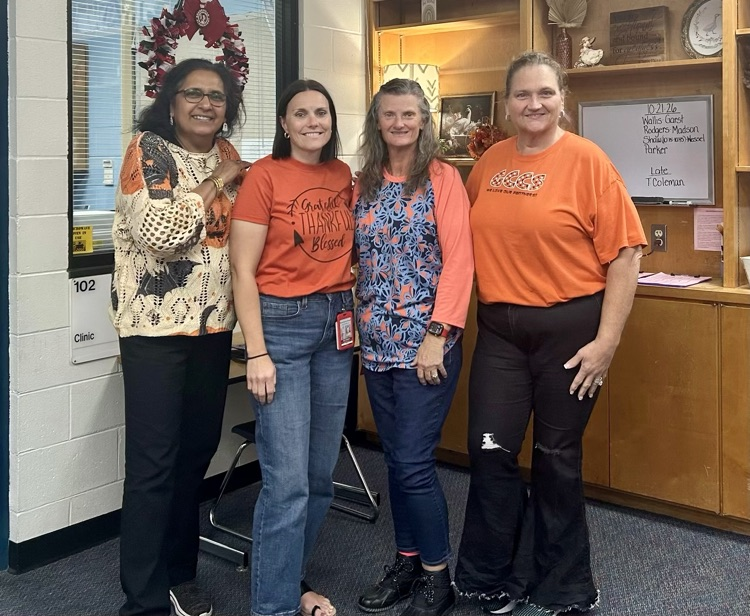 staff wearing orange 